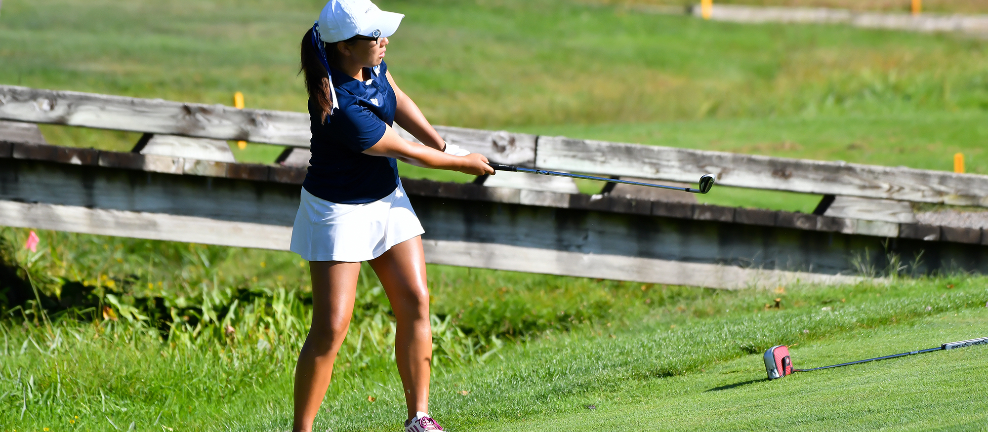Action photo of Lyons golfer, Susan Lee.
