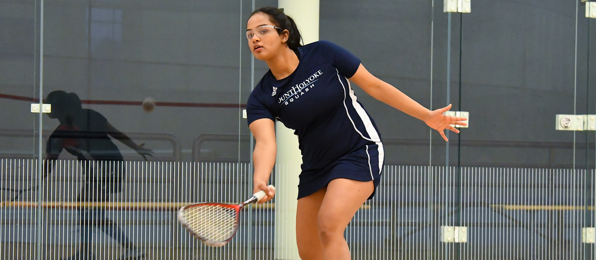 Action photo of Lyons squash player, Tanishka Sachidanand.