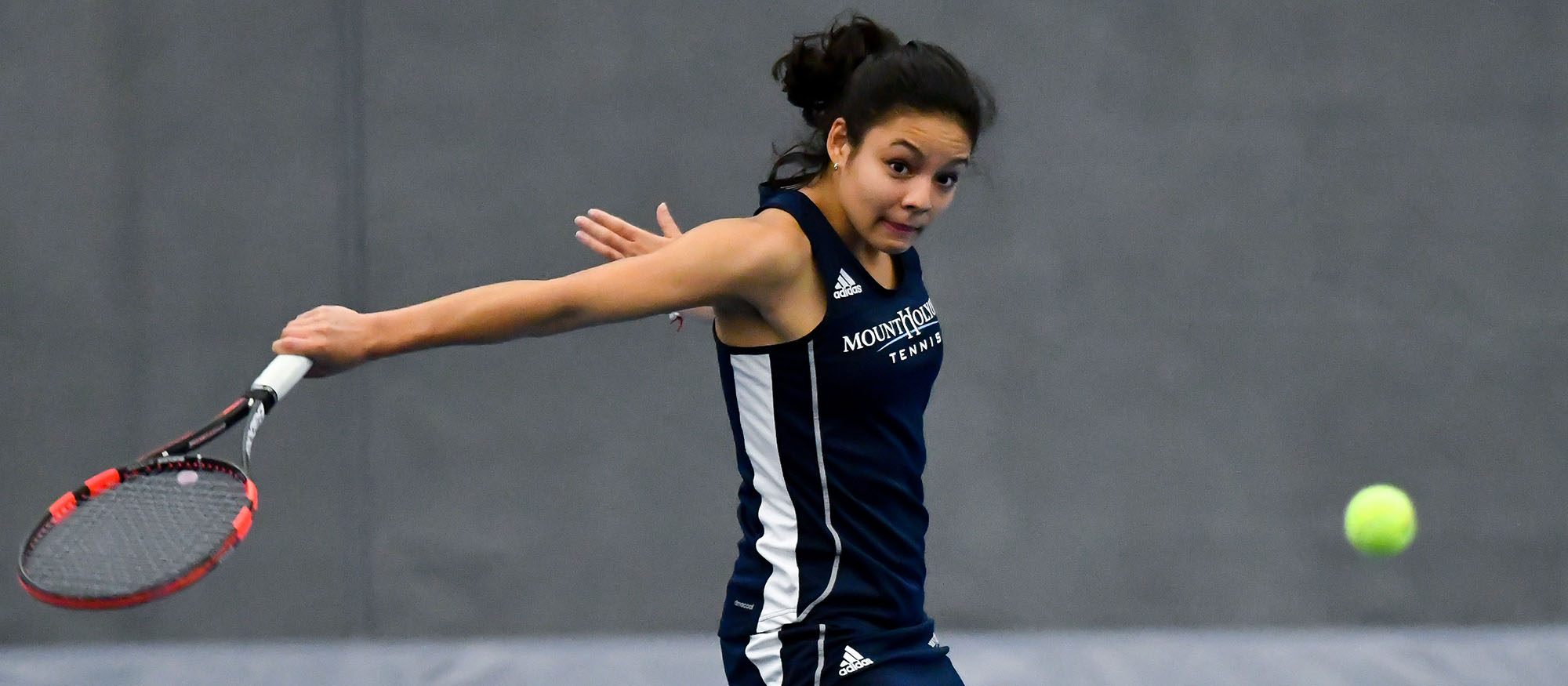 Action photo of Lyons tennis player, Catherine Peabody