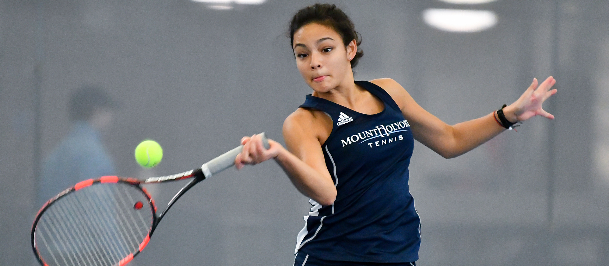 Action photo of Lyons tennis player, Catherine Peabody