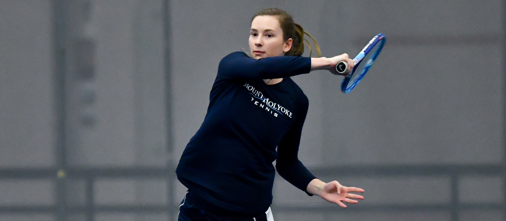 Action photo of Lyons tennis player, Joy Maran.