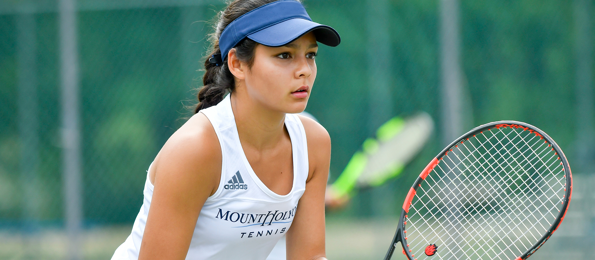 Action photo of Lyons tennis player, Catherine Peabody