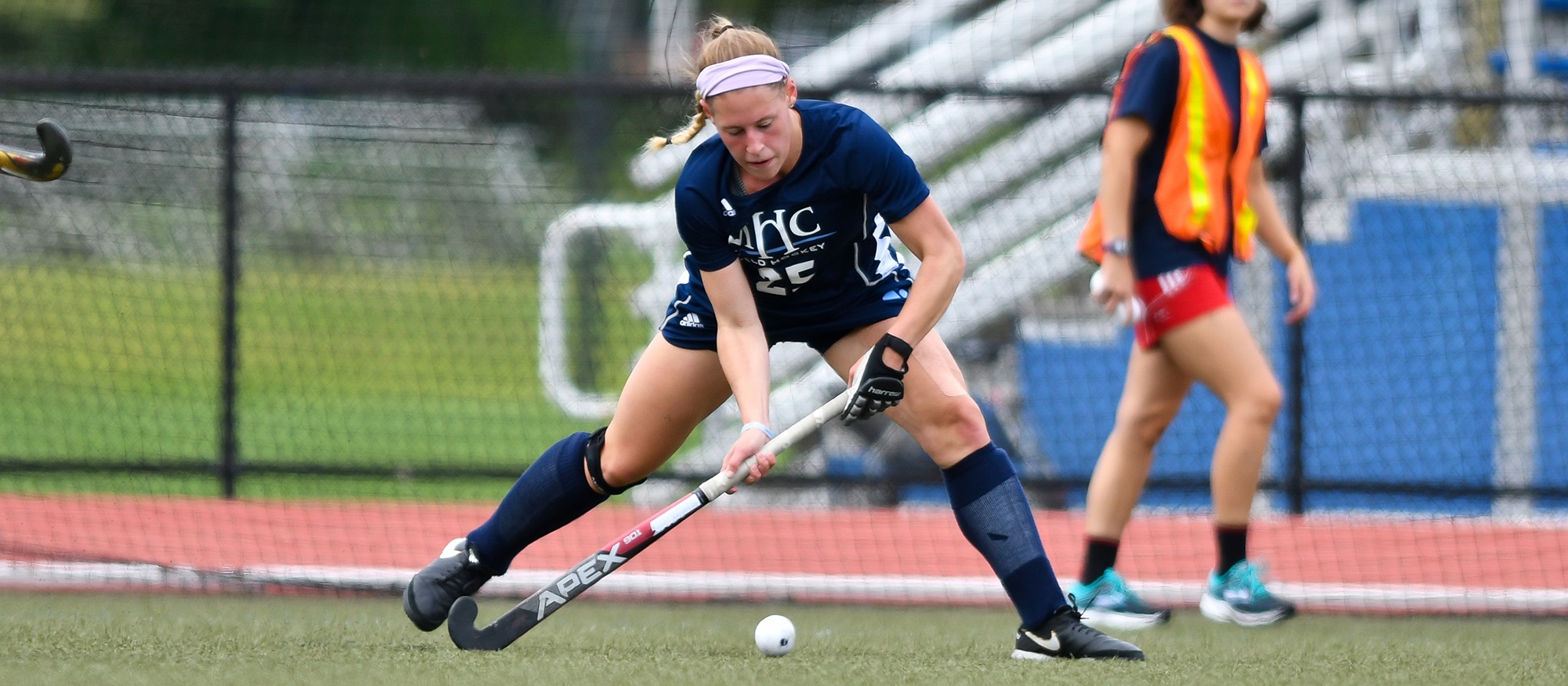 Action photo of Lyons field hockey player, Laurissa Montigny.