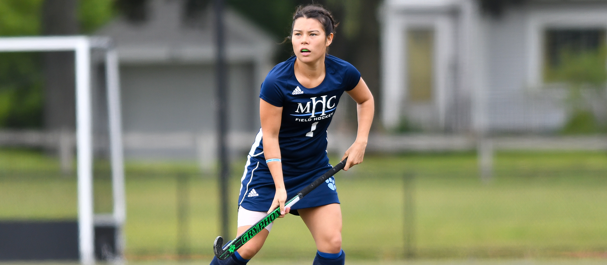 Action photo of Lyons field hockey player, Liz Delorme.