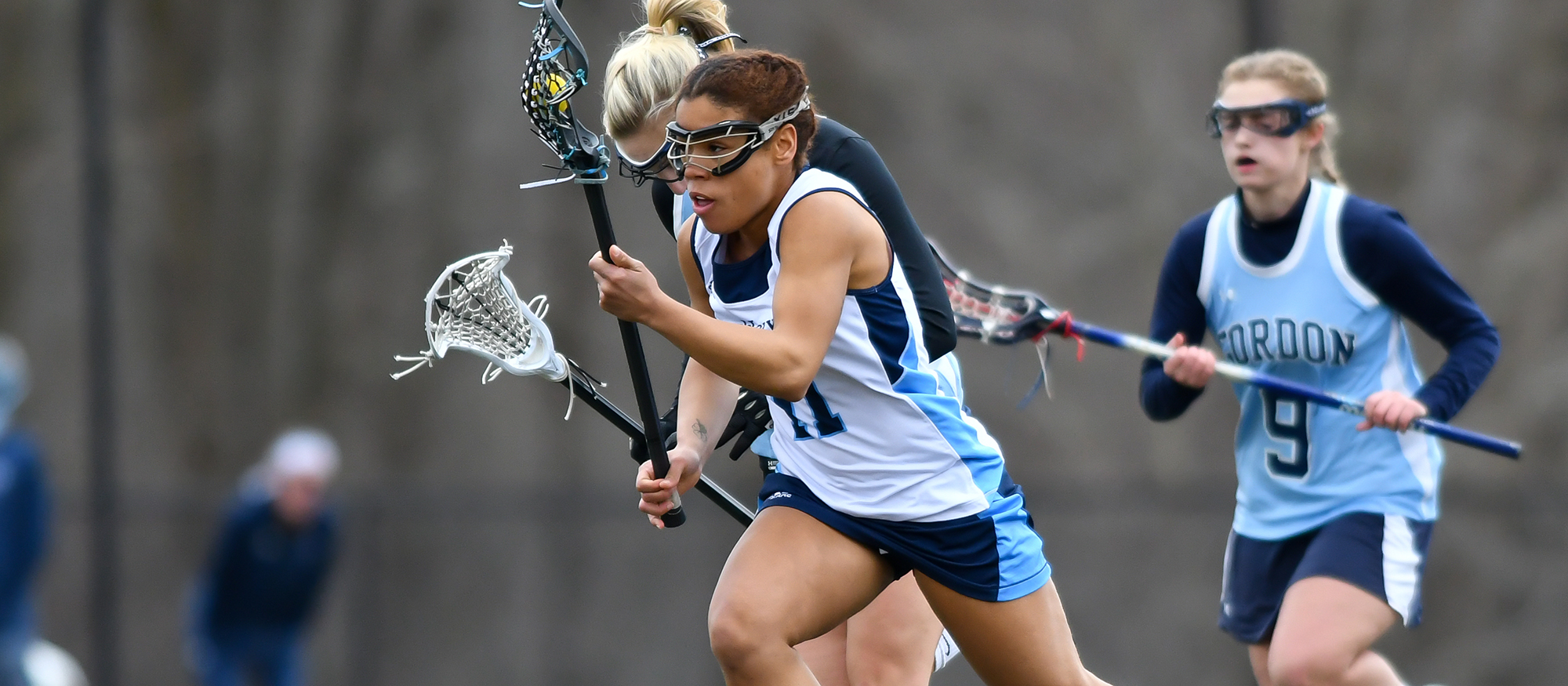 Action photo of Lyons lacrosse player, Deyscha Smith.