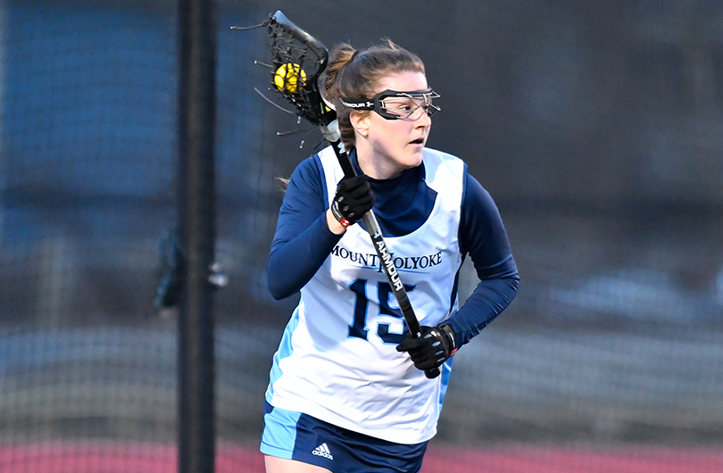 Action photo of Lyons lacrosse player, Abby Baldwin.