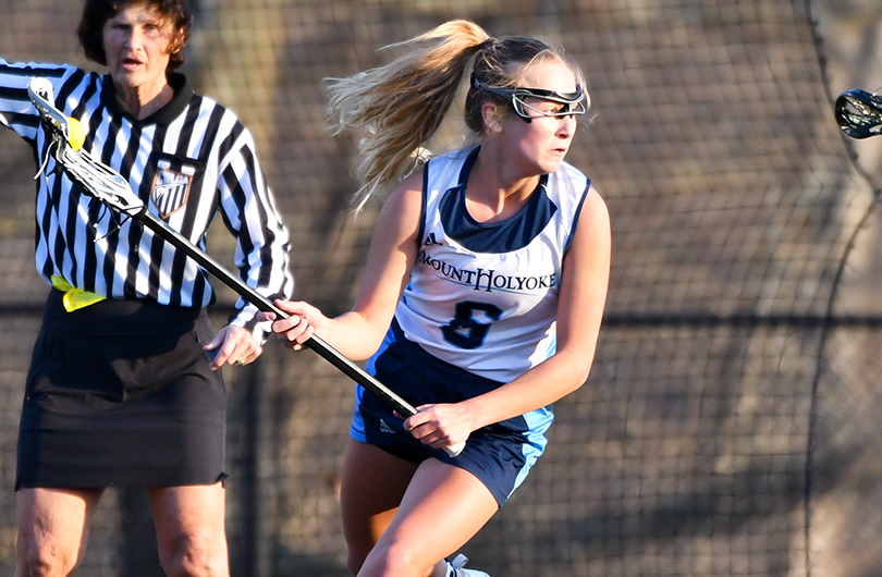 Action photo of Lyons lacrosse player, Caroline Flynn