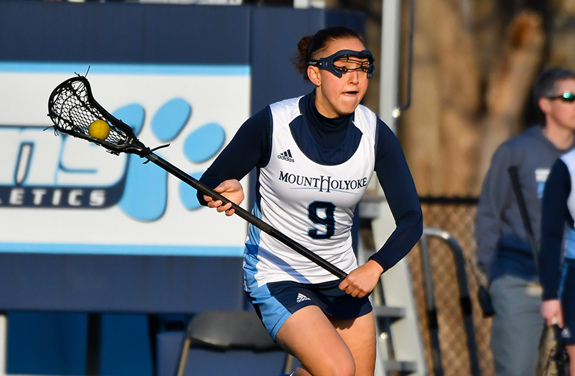 Action photo of Lyons lacrosse player, Kat Violette.