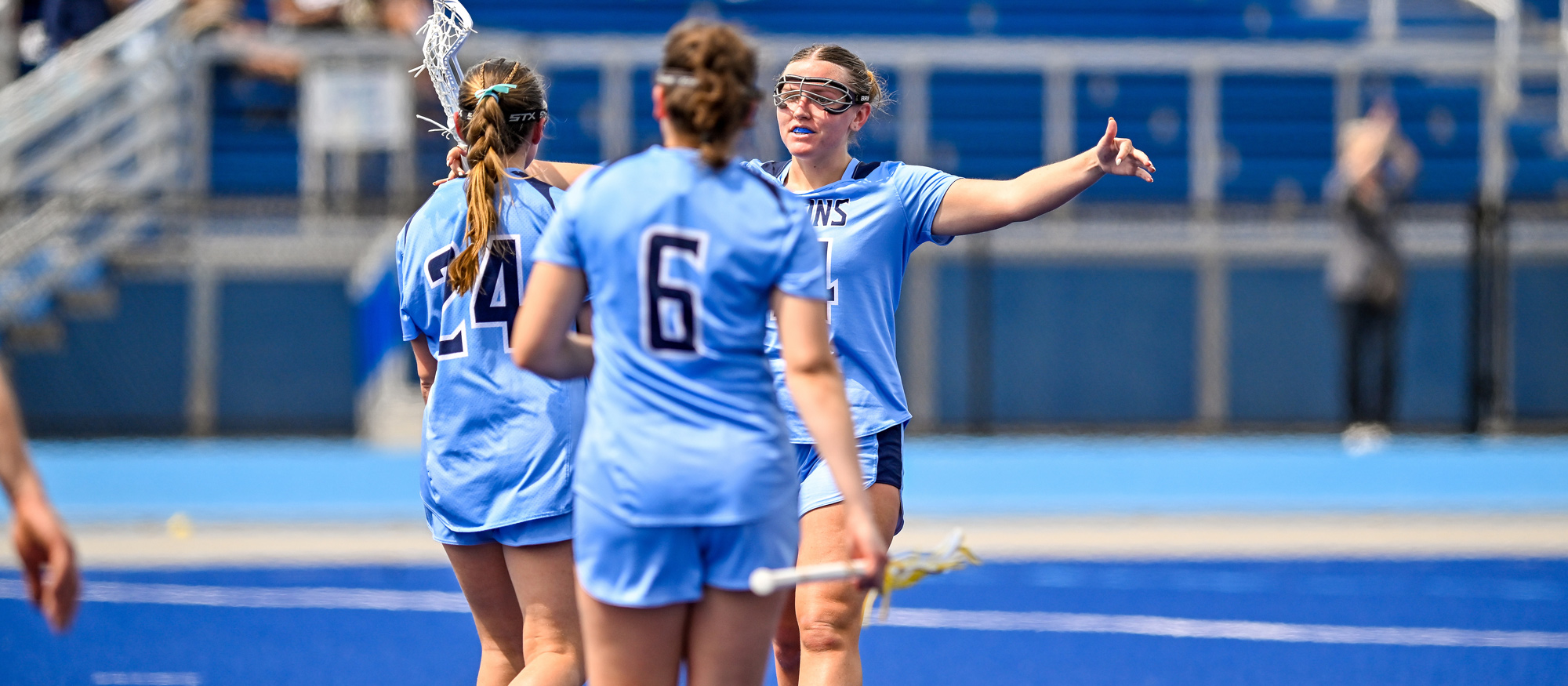 Emi Bisson (facing camera) had five goals and five assists, while Juliana Spaulding (24) had four goals and Marielle Welch (6) added one in Mount Holyoke's 20-2 season-opening victory over Elms on Feb. 25, 2026. (RJB Sports file photo)