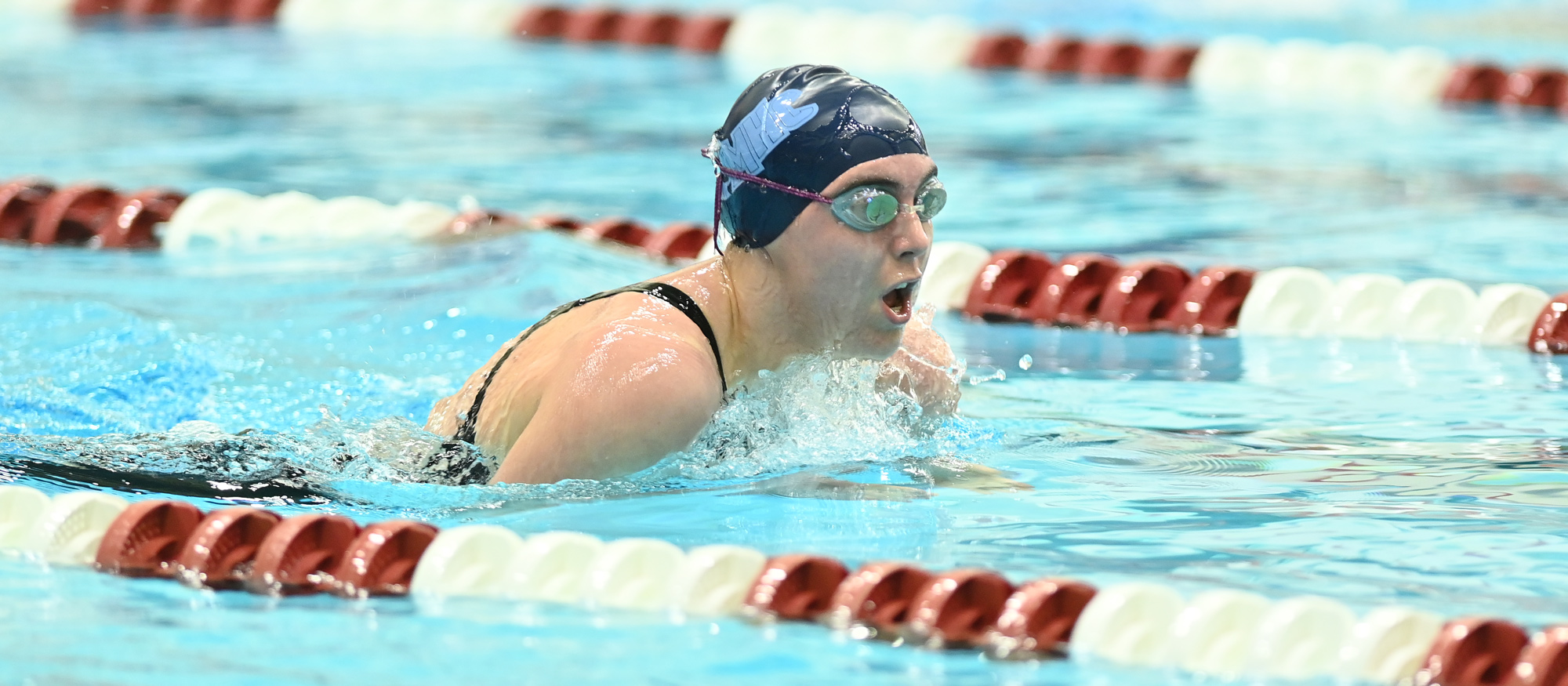 Mount Holyoke's Isabel Dunn swims in the B Final of the 400-yard individual medley at the NEWMAC Championships at MIT on Feb. 21, 2026. (Gil Talbot)