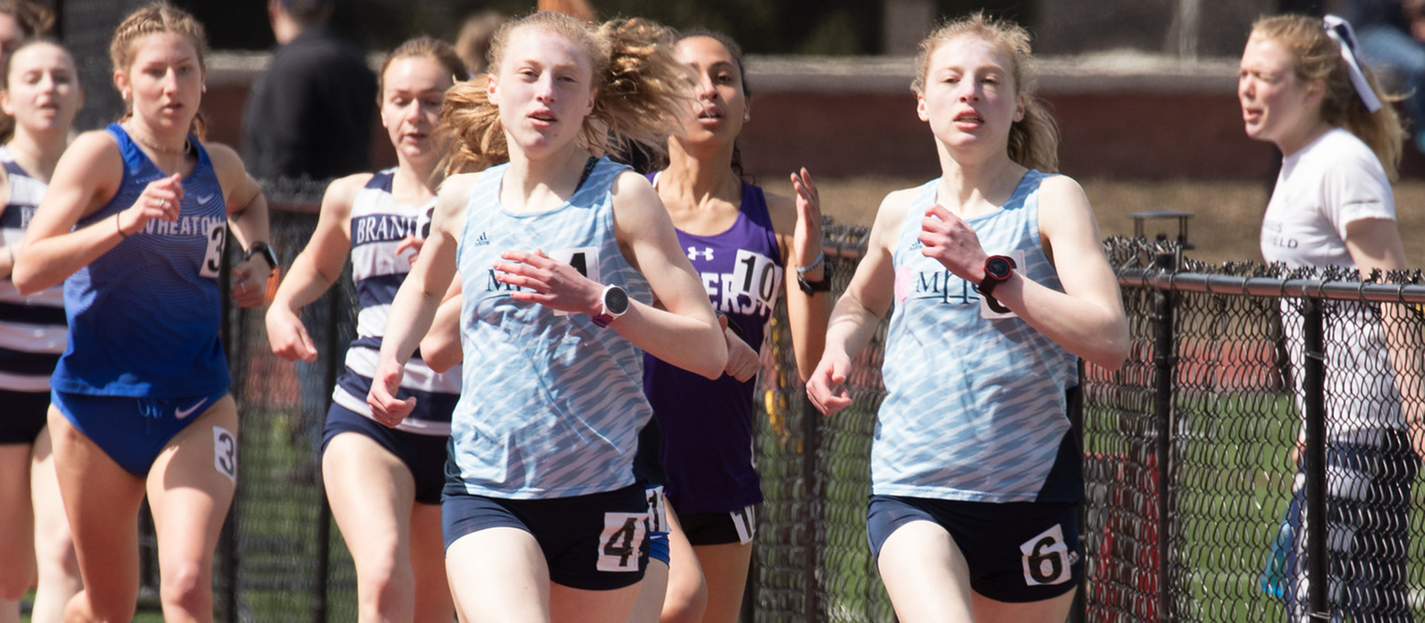 Action photo of Lyons track & field athletes, Hannah and Madeline Rieders - Photo courtesy of J. Cronin - outrageousphotography.net.