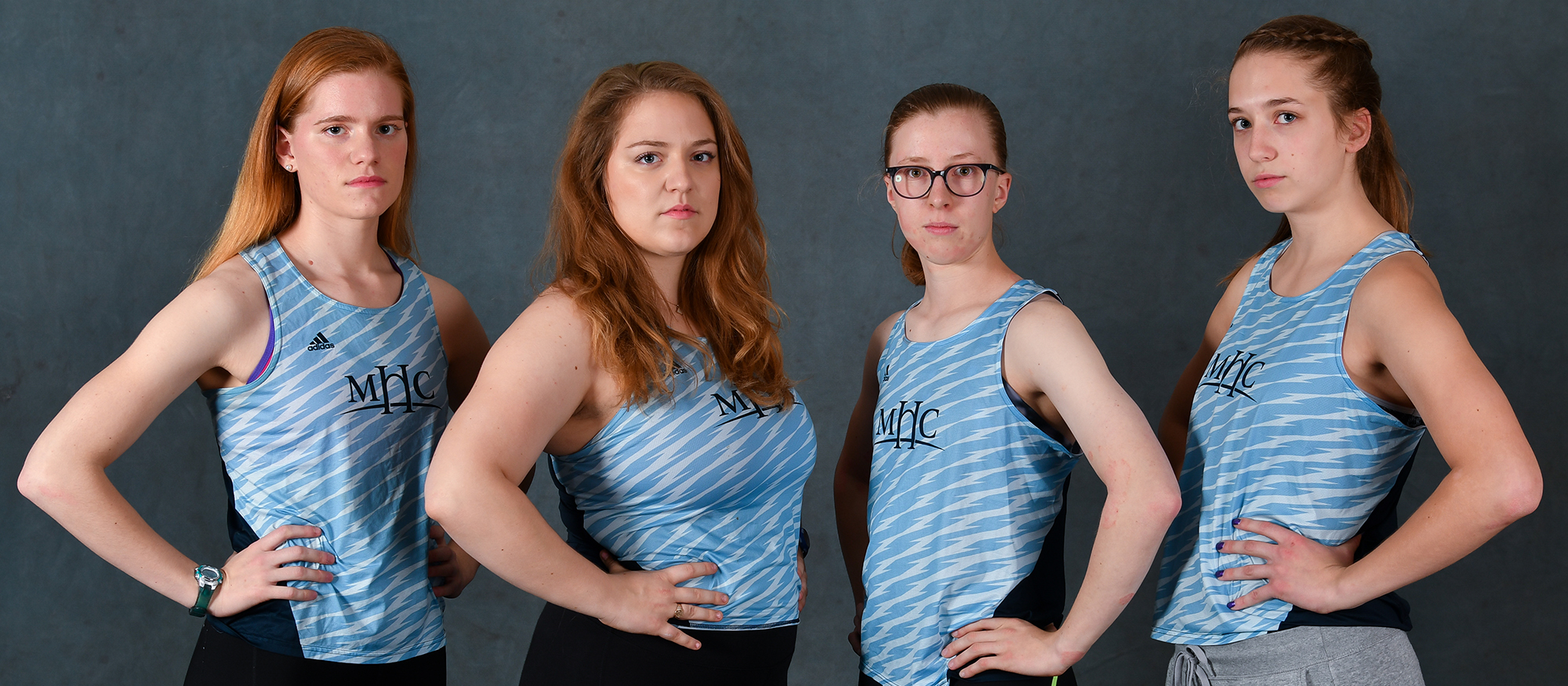 Photo showing members of the Lyons Track & Field Team posing, including Charleen Theroux, Julia Hecking, Isabelle Wohlin and Sarah Bishop.