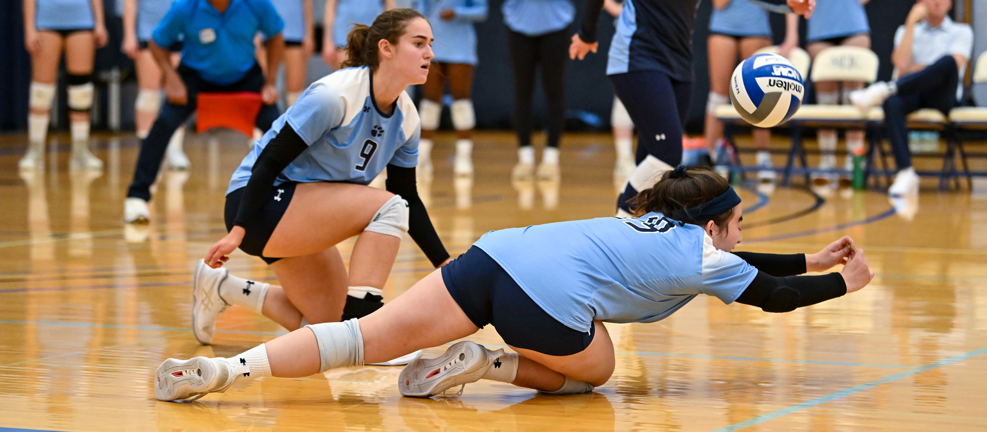 Amelia Ringor (right) and Lucie Berclaz (left) totaled 13 and 11 digs, respectively, in Mount Holyoke's 3-0 loss to No. 5 MIT on Oct. 5, 2024. (RJB Sports file photo)