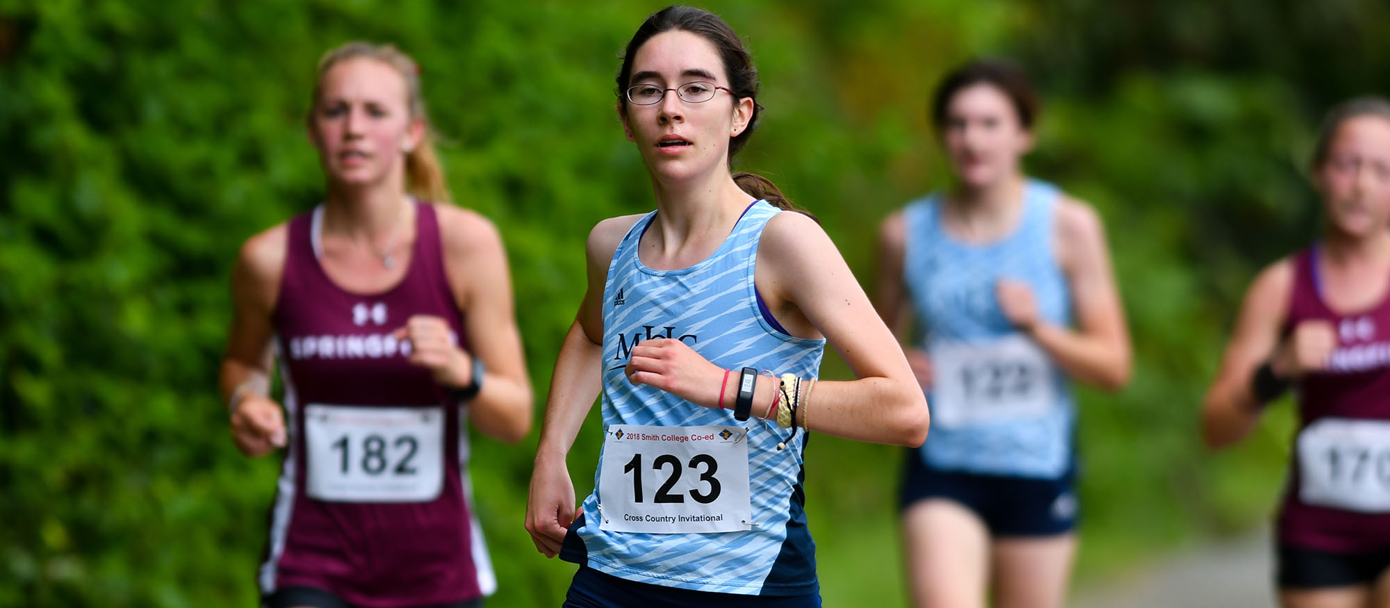 Action photo of Lyons cross country runner, Sarah Hyde